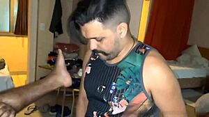 Gay friends playing video game then relaxing on sofa after game ends