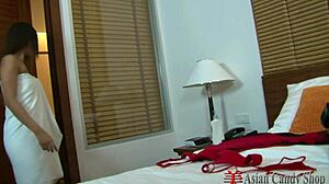 Asian teen undresses and rubs tits