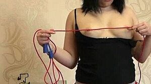 Brunette in Tight Shorts Masturbates With Rope, Bangs Hairy Pussy