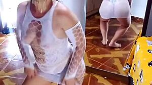 Undressing white sensual bodysuit and black panties.