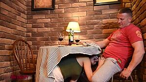 Crazy hot girl sucks cock under table in public cafe