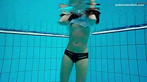 Horny teen gets naked fast by the pool, showing her tight pussy