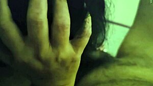 Latina gives a nocturnal blowjob to her lover in the dark bedroom.