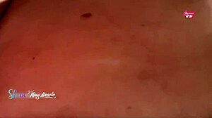 Hot wife flashes big tits while shopping without bra.