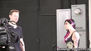 Behind the scenes of an alternative slut posing in goth lingerie and heels