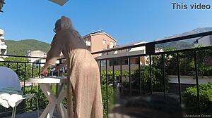 hey, ever seen someone go nude on a public balcony like this?