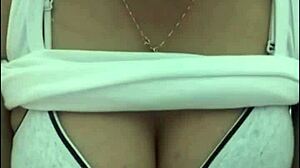 Big Tits Webcam Show Features Busty Woman Displaying Her Assets.