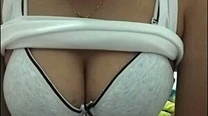 Big Tits Webcam Show Features Busty Woman Displaying Her Assets.