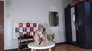 regina noir tries on high heels in a striptease with white lingerie and stockings