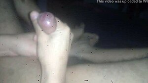 Gay guy cums on feet in casual scene