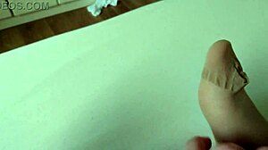 Having fun with my BBW slut in nylon foot play close-up.