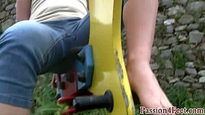 Outdoor babe plays with feet in heels