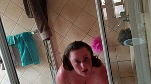 Busty fat guy gives sexy shower blowjob with dildo play