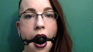 Dark lipstick ballgag drooling with intense eye contact