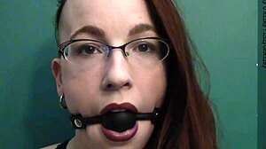Dark lipstick ballgag drooling with intense eye contact