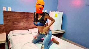 Masked brunette stepsister teases for Halloween in hotel bed.