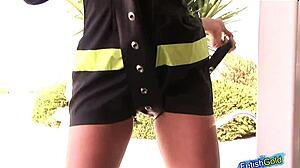 Naughty female firefighter teases outdoor striptease