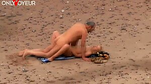 older guy spies on hot milf at beach