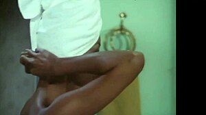 Sexy ebony girl undresses in steamy bathroom scene