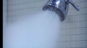 Sexy ebony girl undresses in steamy bathroom scene