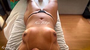 Brazilian wife topless during massage, tiny bikini exposes pussy