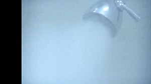 Sexy ebony girl undresses in steamy bathroom scene