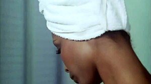 Sexy ebony girl undresses in steamy bathroom scene
