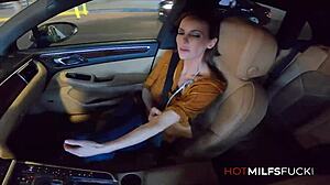 Ainsley Adams gets her big tits licked and a facial in the car.