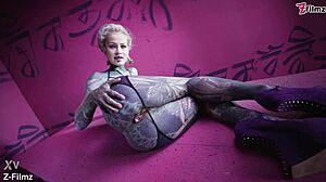 Tattoo goth punk babe fingers solo, showing off anal gapes with buttplug collection