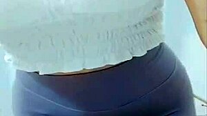 the young asian girl dances in the room, showing off her cameltoe