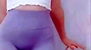 the young asian girl dances in the room, showing off her cameltoe