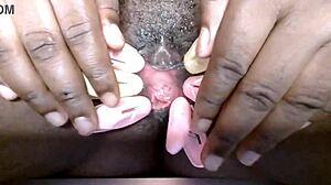cyndy blackslave's shaved pussy clamped close-up