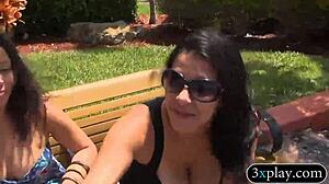 Two brunettes flash big tits outdoors for quick cash.