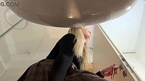 Hot Blonde Babe in Pantyhose and Heels Strips in Bathroom Miniskirt