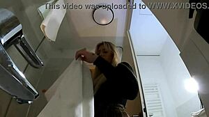 Hot Blonde Babe in Pantyhose and Heels Strips in Bathroom Miniskirt