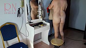 At the nude barbershop, the hairdresser convinces a curvy lady to undress for a wild haircut scene.