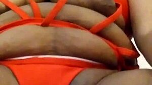 Ooh, The Sexy Ebony Woman With Tattoo Performs Actions.