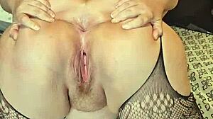 Sexy MILF in Fishnets Spreading Her Ass Cheeks Seductively