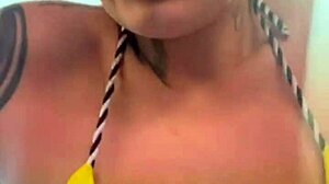 Amateur gets soaking wet pussy training in thong bikini at beachfront gym.