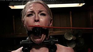 This blonde is tied up in bdsm bondage, cumming hard