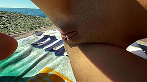 Petite cutie jerks my cock on beach