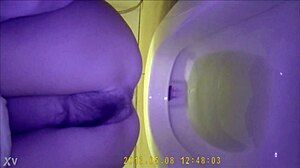 Hidden camera shows asian teen using the bathroom discreetly