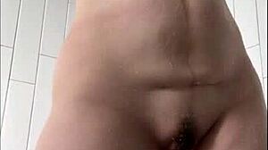 Milf masturbates wet clit in shower