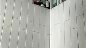 Milf masturbates wet clit in shower