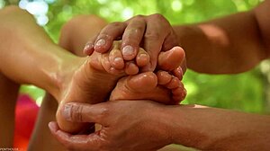 Gina Gerson gives an oiled outdoor footjob