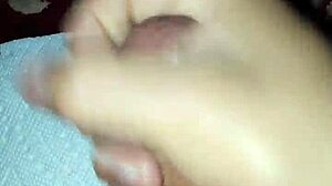 Enjoying a solo session with adult videos