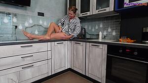 Mature Redhead Iris Teases with Legs in Pantyhose.