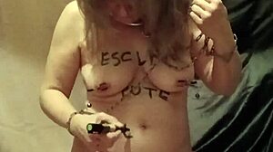 Slave endures self-bondage and wax play outdoors