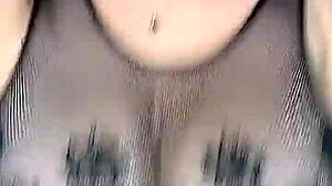 In stockings on the body mesh fucks huge natural tits from above