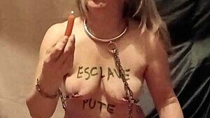 Slave endures self-bondage and wax play outdoors